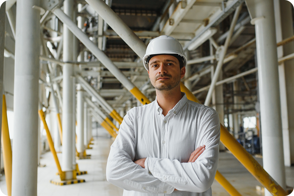 A man in a hard hat stands in an industrial facility, representing manufacturing or engineering SMEs. ccMonet’s AI - powered financial tools (bookkeeping, dashboards) and industry - tailored services, plus expert support (tax compliance, business registration), help such businesses manage finances efficiently.
