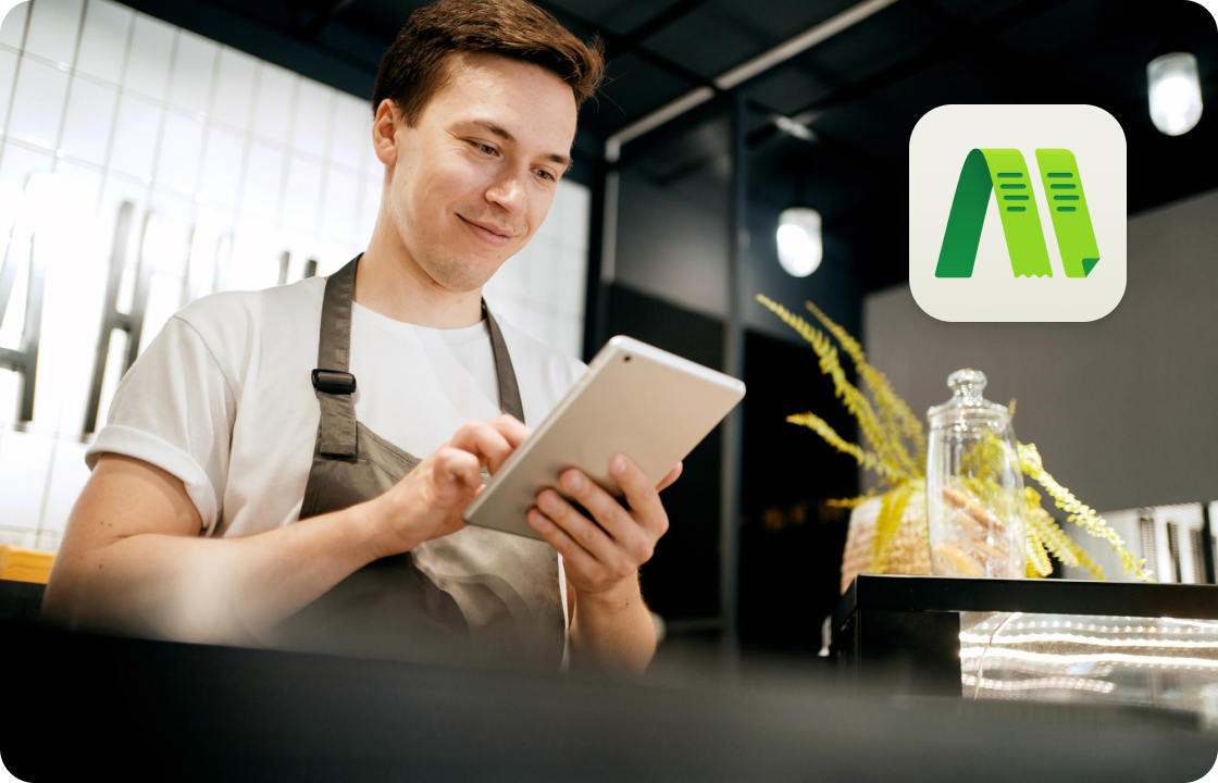 A man in an apron uses a tablet in a café, with ccMonet’s app icon. It represents hospitality - industry SMEs (like café owners). Our AI - powered financial tools (bookkeeping, dashboards) and expert services help manage finances, streamline workflows, and ensure compliance efficiently....