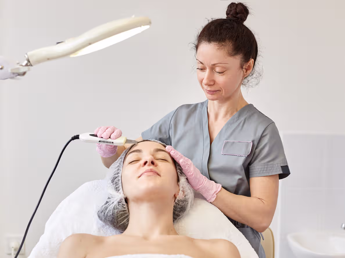 A beautician provides facial treatment, representing beauty - service SMEs. ccMonet’s AI - powered financial tools (bookkeeping, dashboards) and expert services (compliance, tax support) help such businesses manage finances, streamline workflows, and ensure regulatory adherence efficiently....