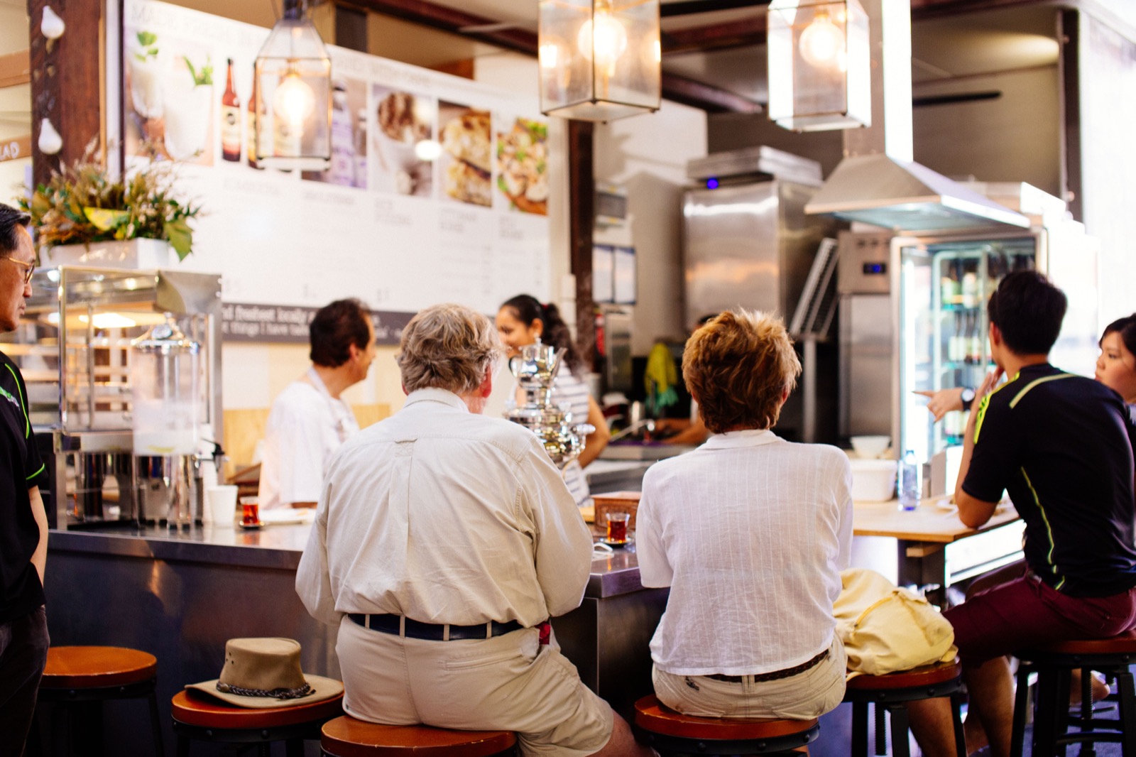 Guests and staff in a bright casual restaurant