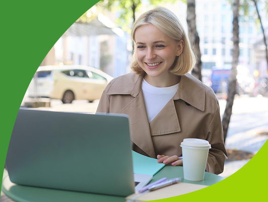 A woman works on a laptop at an outdoor table, with a coffee and stationery beside her. This scene reflects how ccMonet’s AI - driven finance tools (bookkeeping, payroll, dashboards) and expert services (tax compliance, business registration) support flexible, efficient financial management for SMEs, enabling work anywhere.
